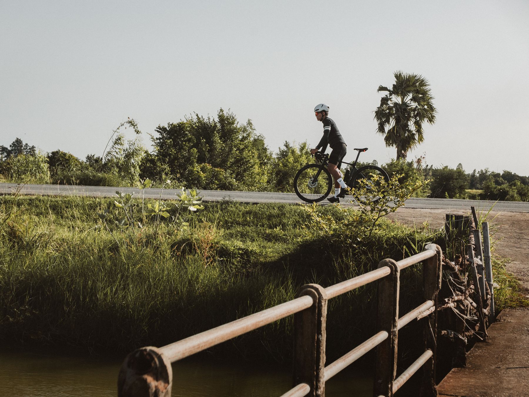 Rider crossing bridge
