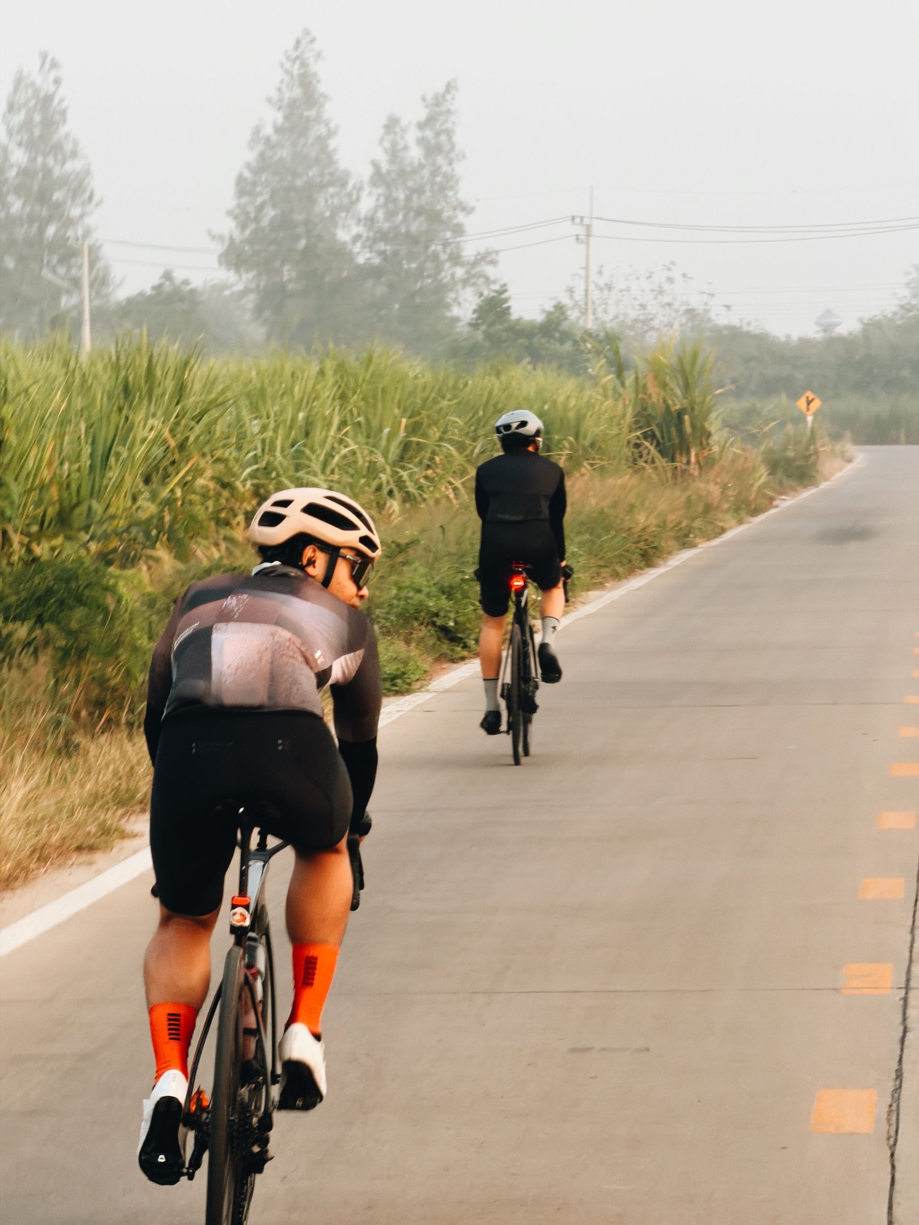 Two riders in morning mist